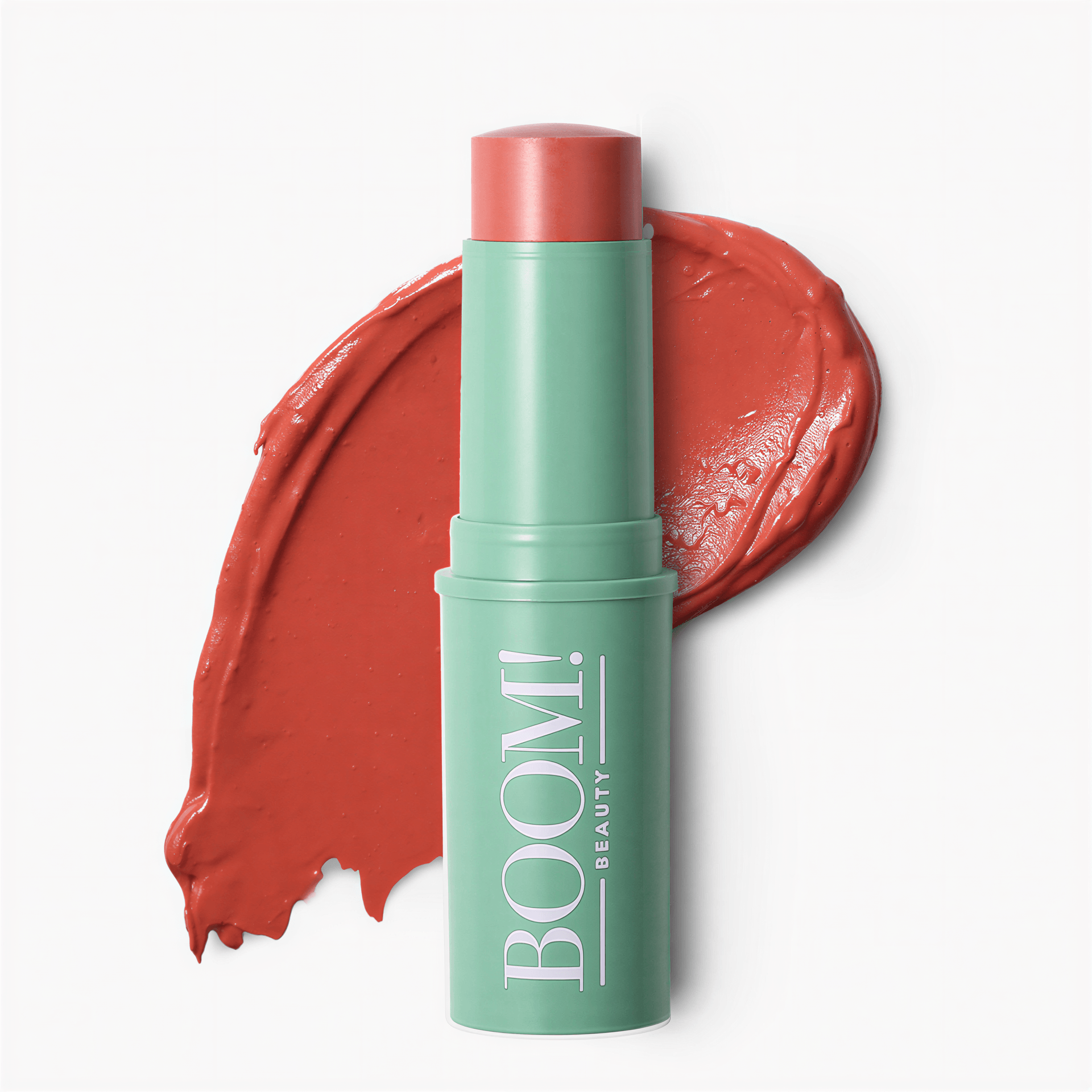 One peach cream makeup stick in a mint green plastic tube labeled BOOM! BEAUTY, shown with a textured peach color swatch.