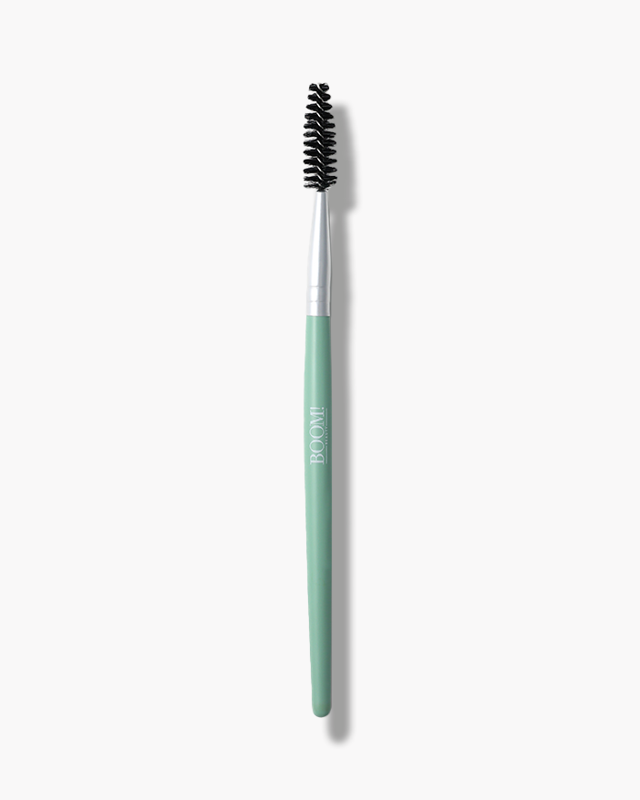 Sculpt & Define Brow Spoolie with a mint green handle and black bristles, designed for shaping eyebrows.